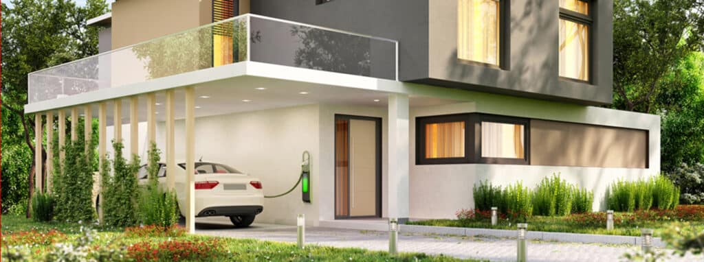 Electric vehicle charging under a carport of a modern home